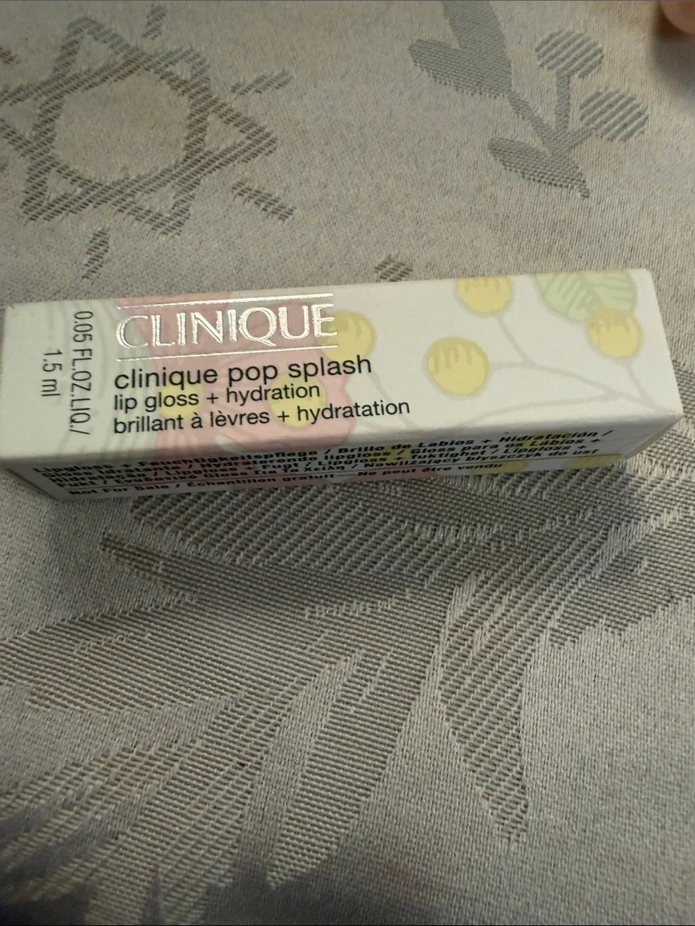 Clinique Yellow Cosmetic Pouch with Red Apple Print and Lip Balms